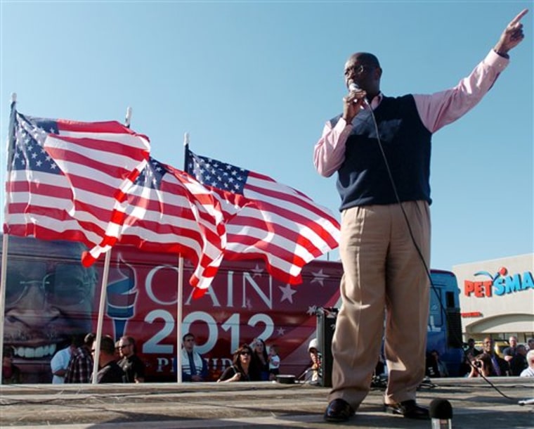 Republican presidential candidate Herman Cain speaks to a crowd at Bob's House of Honda as part of his bus tour, Friday, Oct. 14, 2011 in Jackson, Tenn. (AP Photo/The Jackson Sun, Kenneth Cummings)  NO SALES